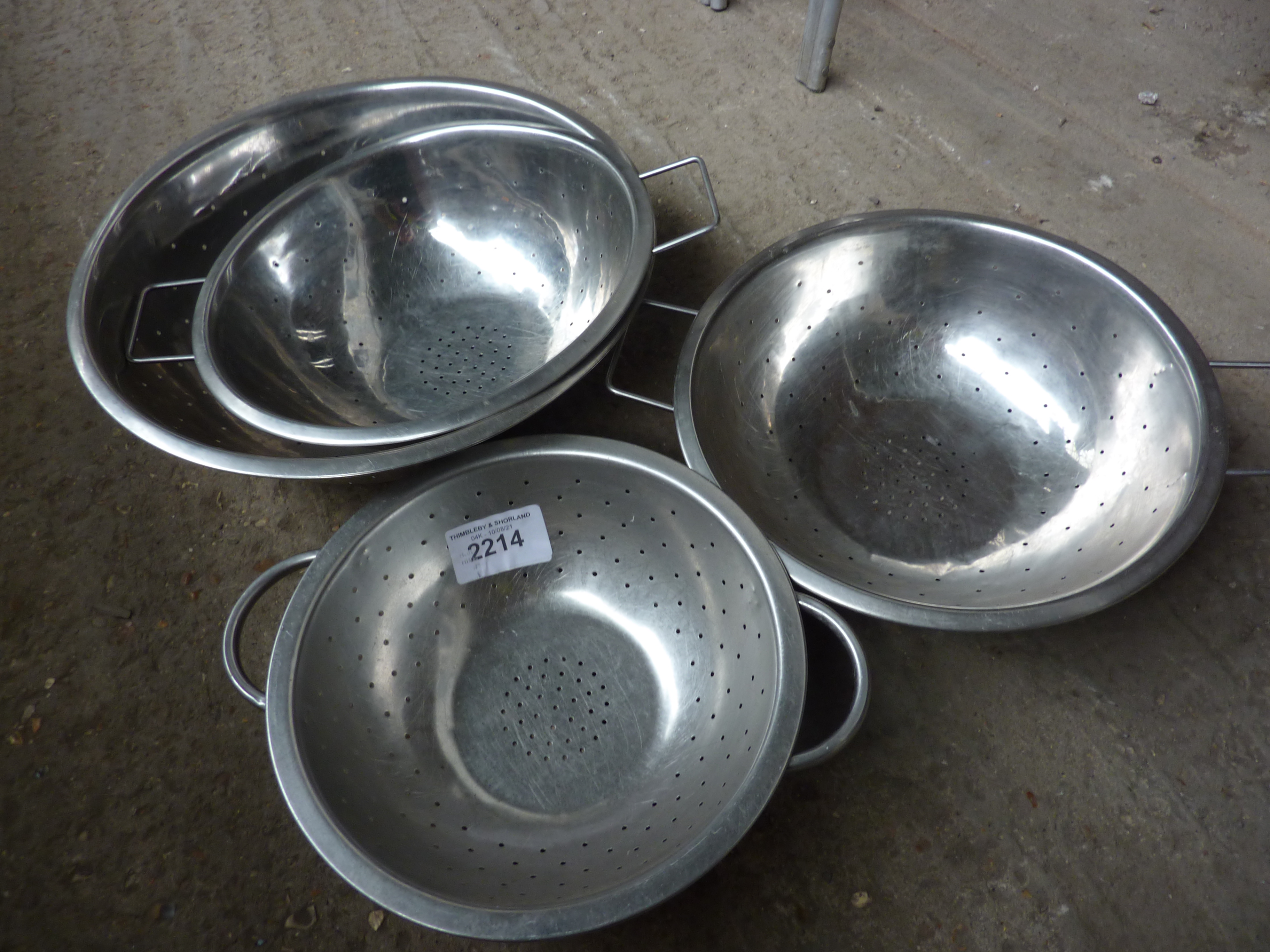 Four round colanders