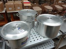 Three cooking pots with lids