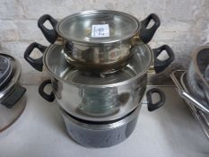 Three saucepans with lids