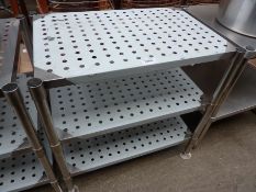 Three tier table with perforations