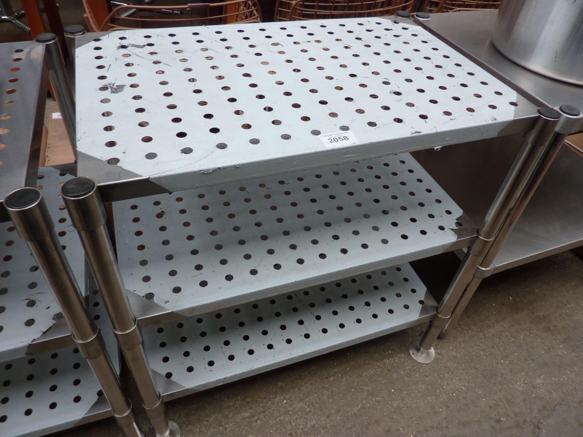 Three tier table with perforations