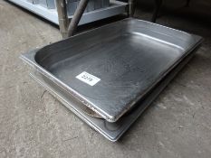 Three stainless steel trays