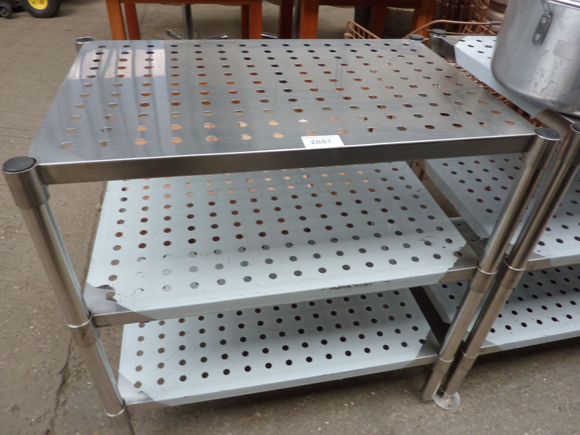 Three tier table with perforations