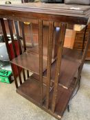 Mahogany revolving bookcase, chest of drawers, leather suitcase, oak stand and pine wall mirror