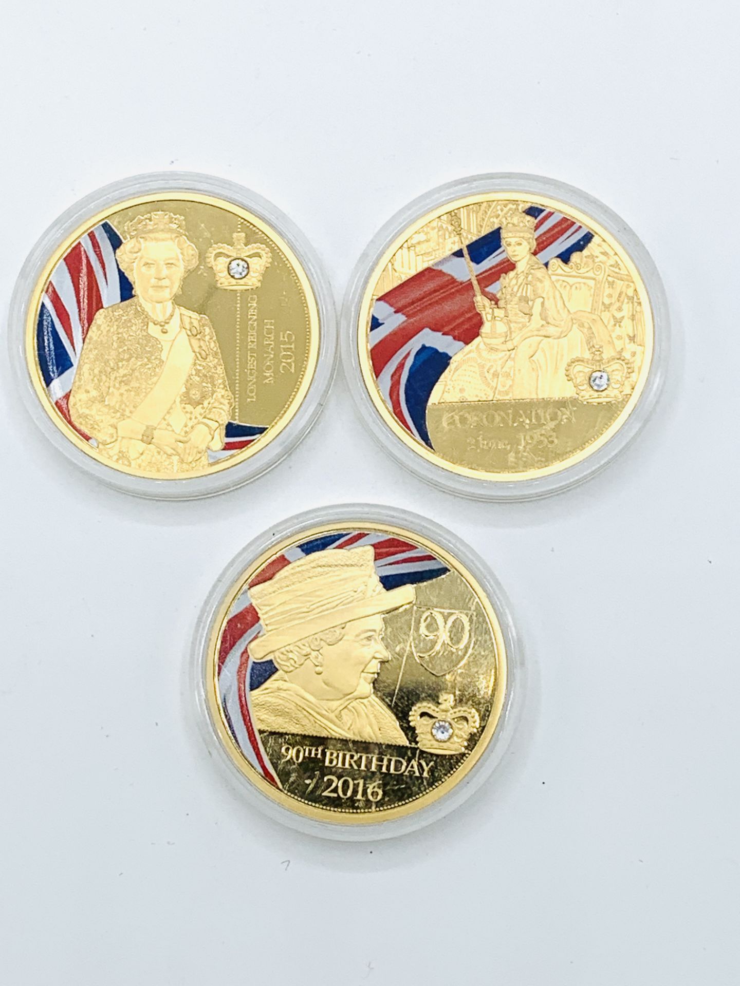 Three gold plated commemorative coins