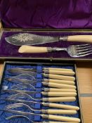 A quantity of boxed cutlery together with other table accessories