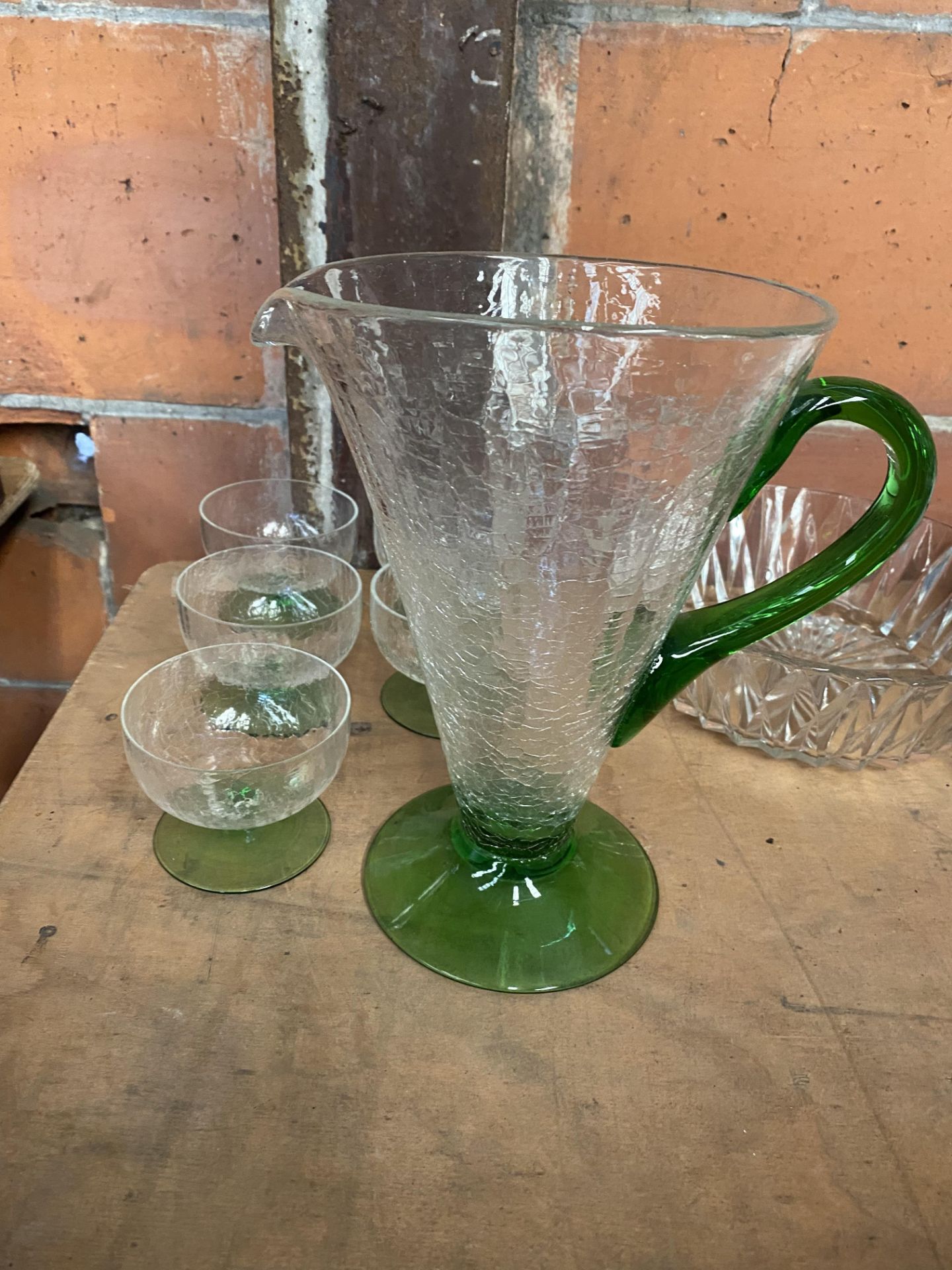 Crackle glaze glass jug, with three matching glasses, together with a glass fruit bowl