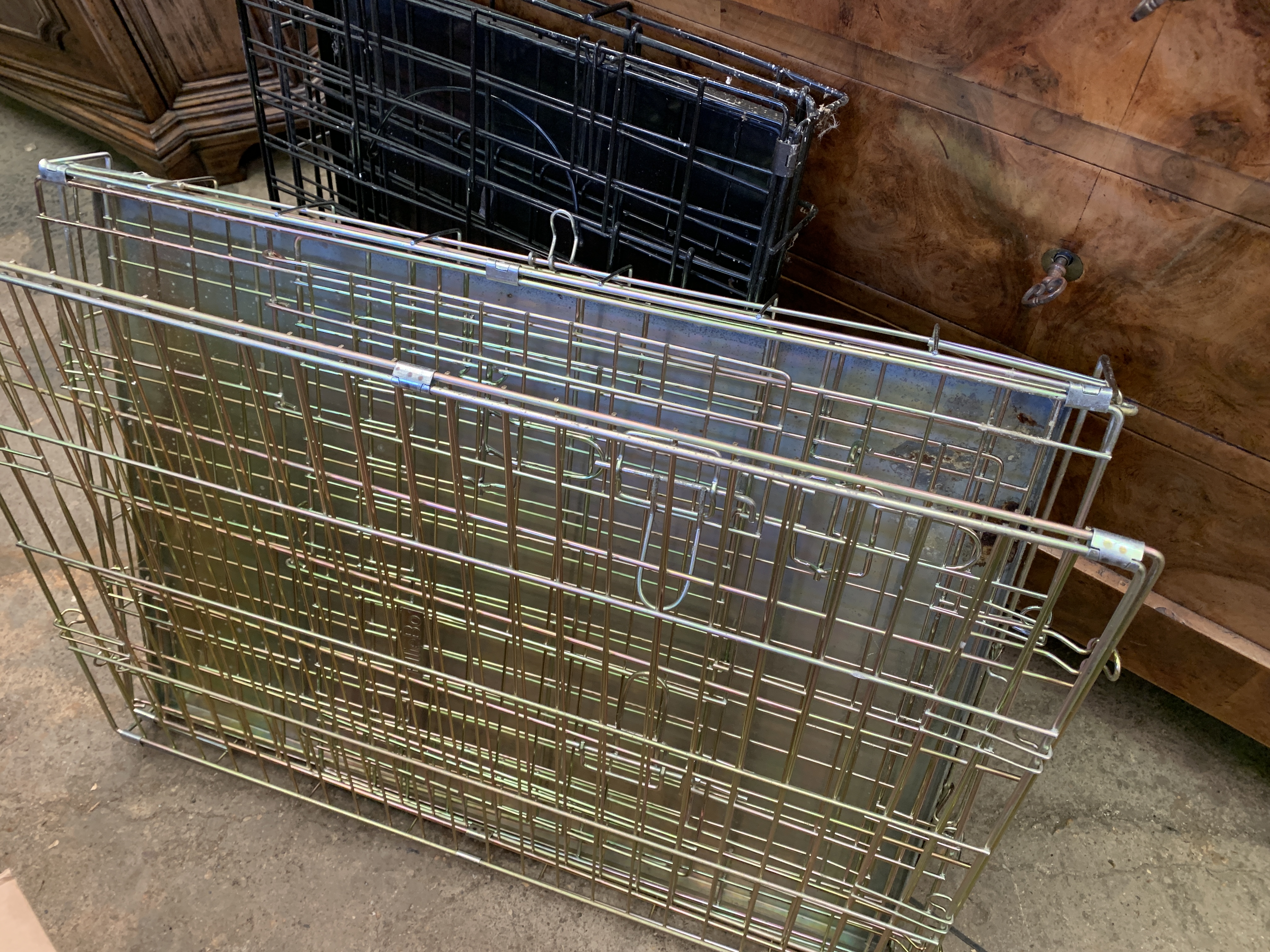 Two folding dog cages