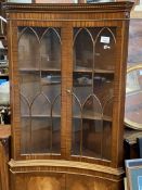 Mahogany concave fronted display cabinet over cupboard to base