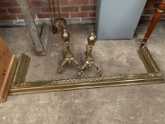 Brass fender with rope twist decoration, two brass firedogs and two brass fire irons.