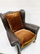 Dark brown faux leather deep wing back armchair