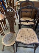 Two cane seated bedroom chairs and an oak spinning chair