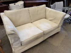 Cream upholstered two seat sofa