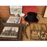 A boxed opera hat, a drinking horn, a games box, and other miscellaneous items