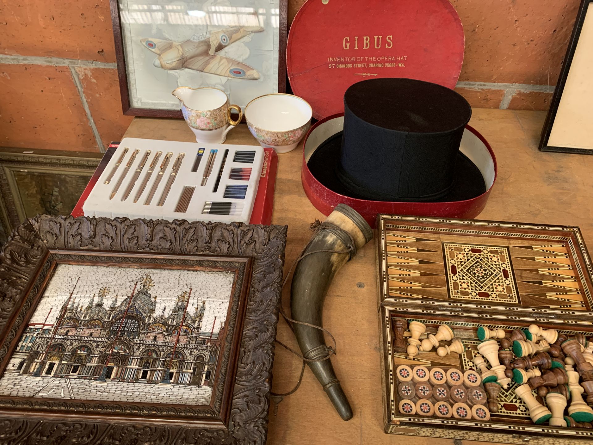 A boxed opera hat, a drinking horn, a games box, and other miscellaneous items