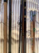 Three fishing rods in slip cases