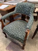 Victorian open armchair with green upholstery