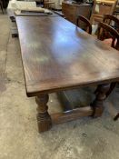 Elm refectory style table on four turned supports with centre stretcher