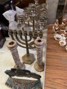 A quantity of candlesticks to include a brass menorah