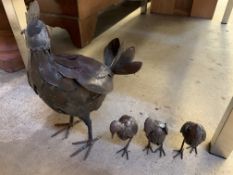 Metal figures of hen with three chicks