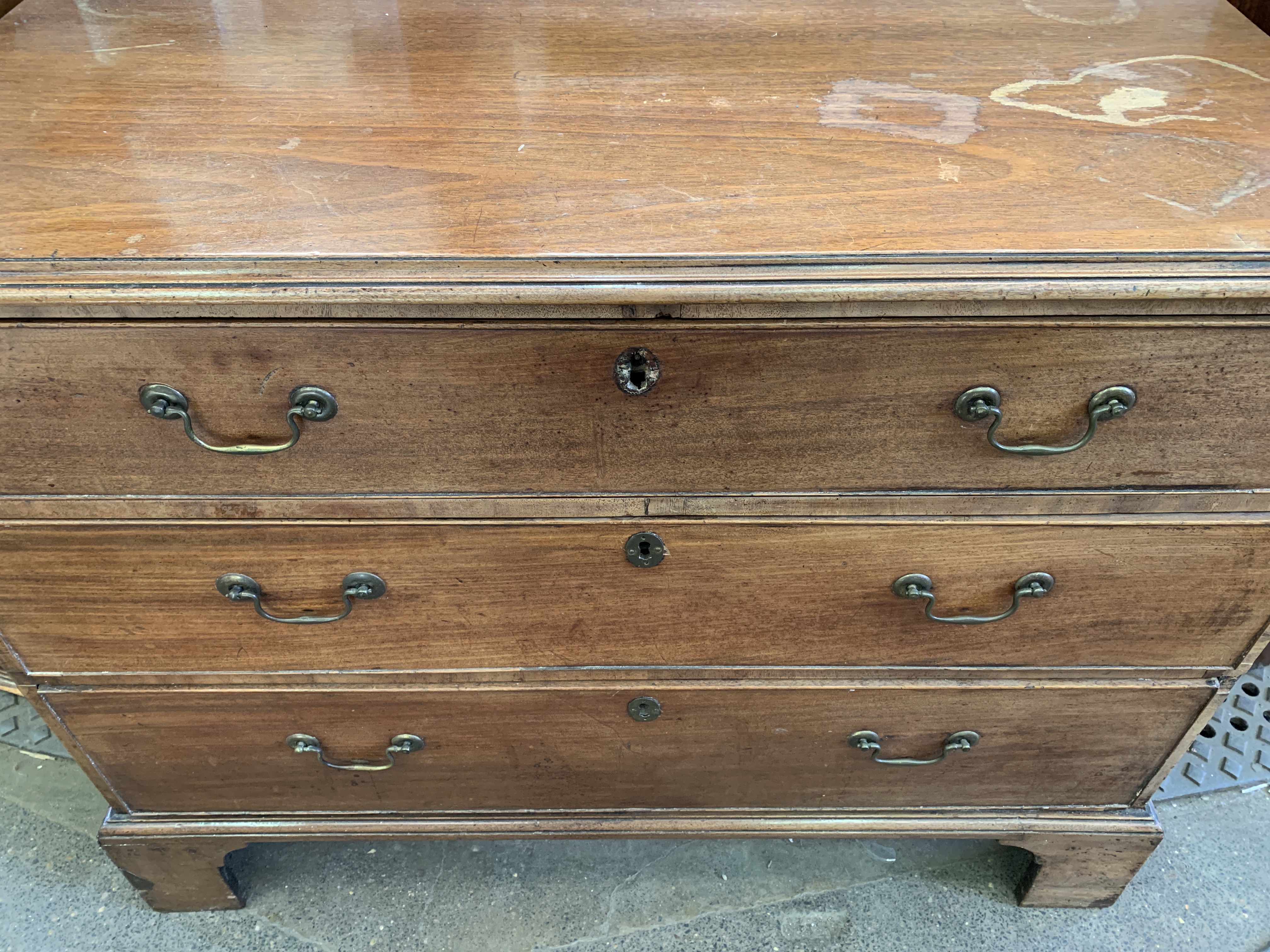 A mahogany chest of three graduated drawers. - Image 7 of 7