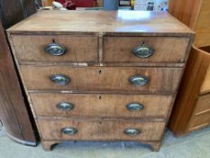 A mahogany veneer chest of drawers
