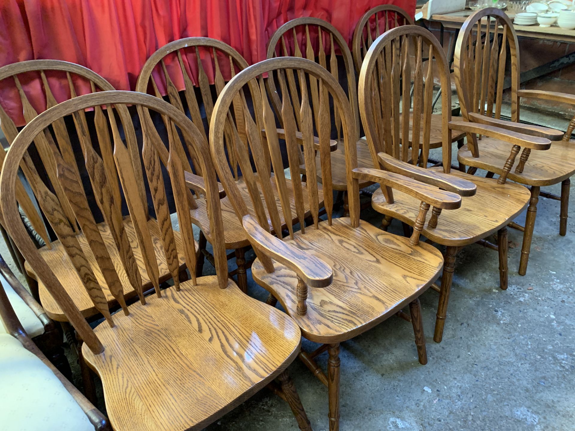 Eight Windsor style oak chairs.