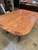 Mahogany tilt top table to pedestal on four legs to castors