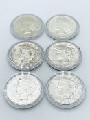 Six US Peace silver dollars