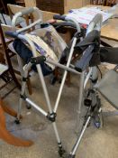 Three walking frames and a wheelchair cozy