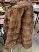 Three quarter length fur coat; together with a fur jacket