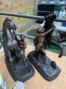 Pair of spelter Marley horses and a metal figure of a stallion