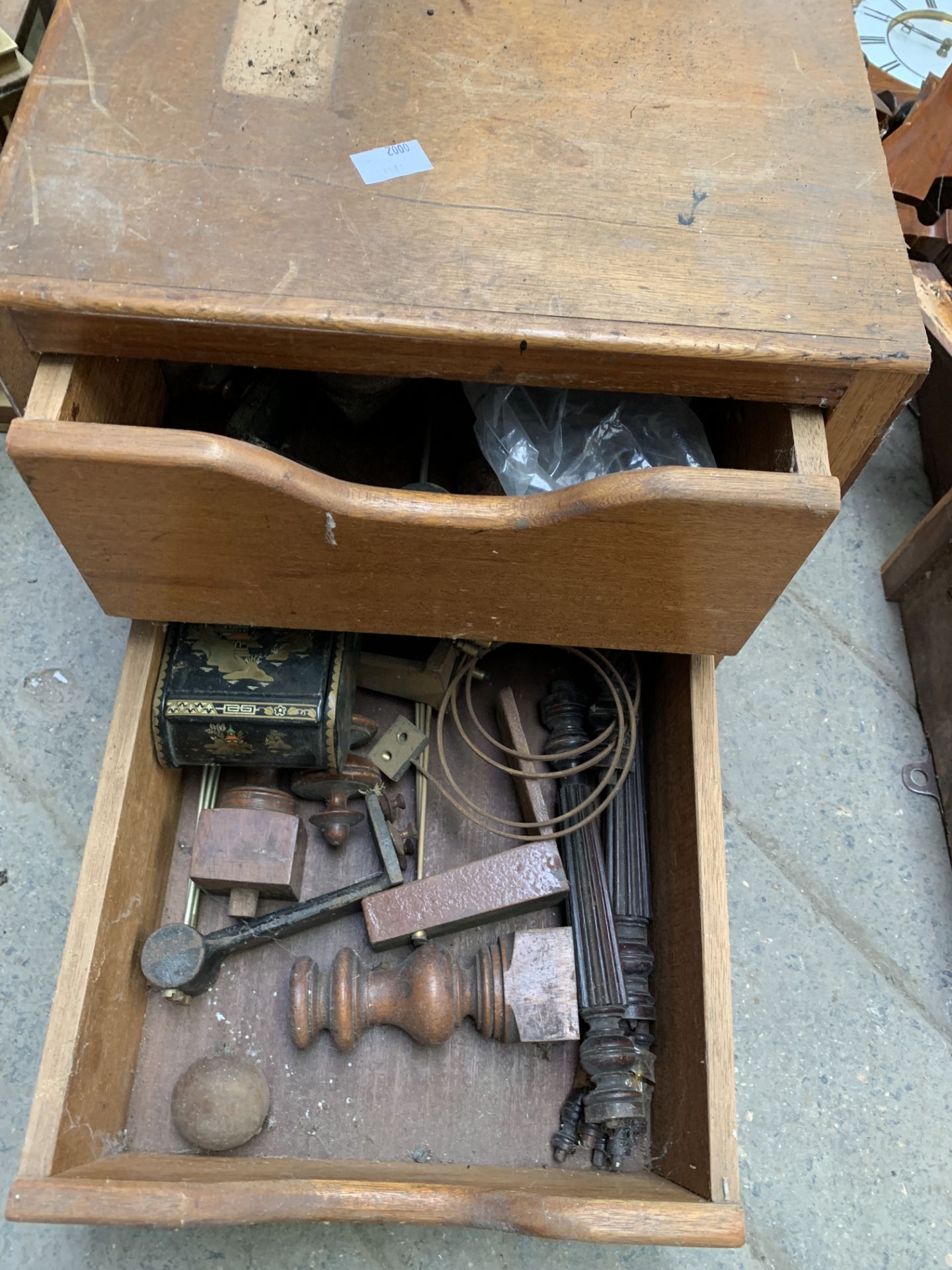 Clock movement and a wooden two door cabinet containing clock parts - Image 2 of 3