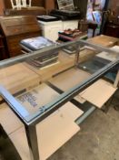 Pair of white metal framed low tables with glass tops