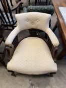 Victorian cream upholstered armchair on castors