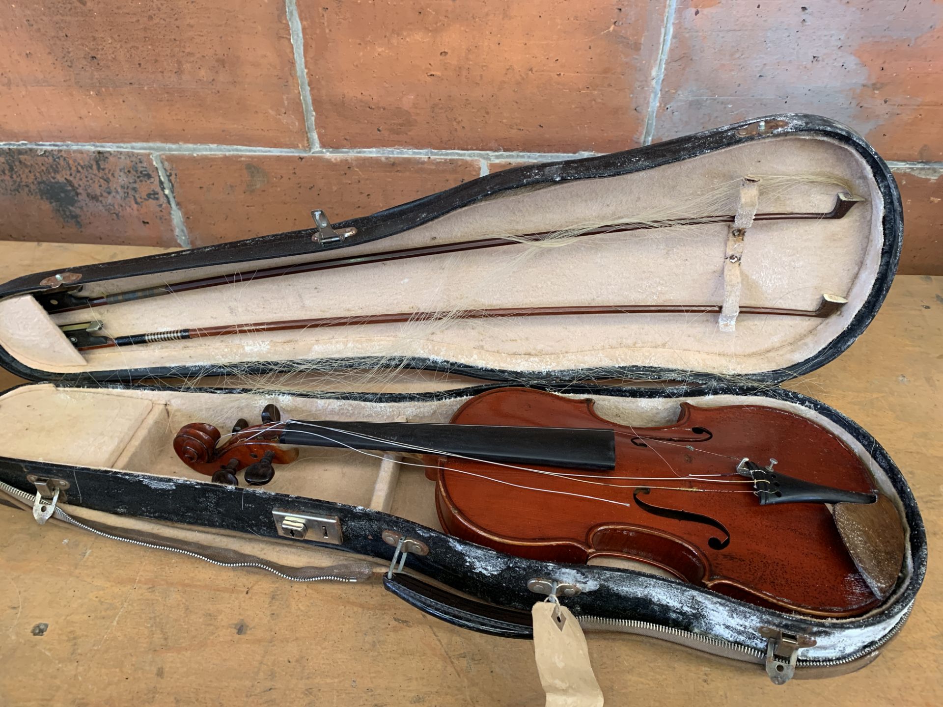 A Luthier Buthod violin in case with two bows, together with another violin