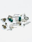 Ten pairs of silver earrings