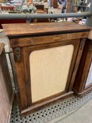 A mahogany glass fronted cabinet.