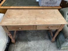 A pine side table with two frieze drawers