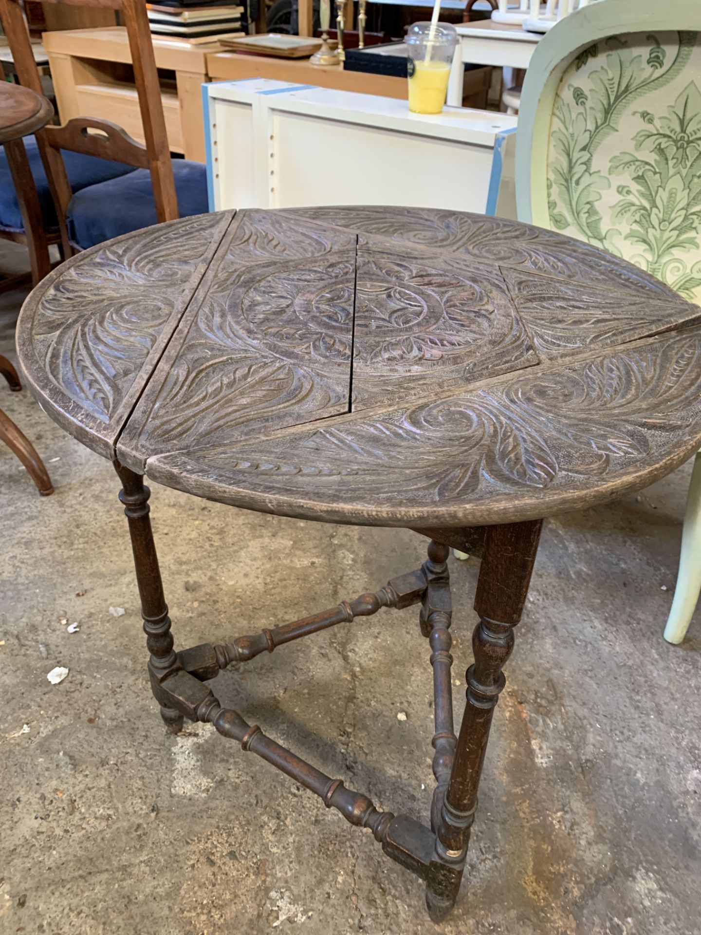 Table with circular top and two tilt top tables