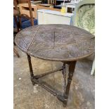 Table with circular top and two tilt top tables