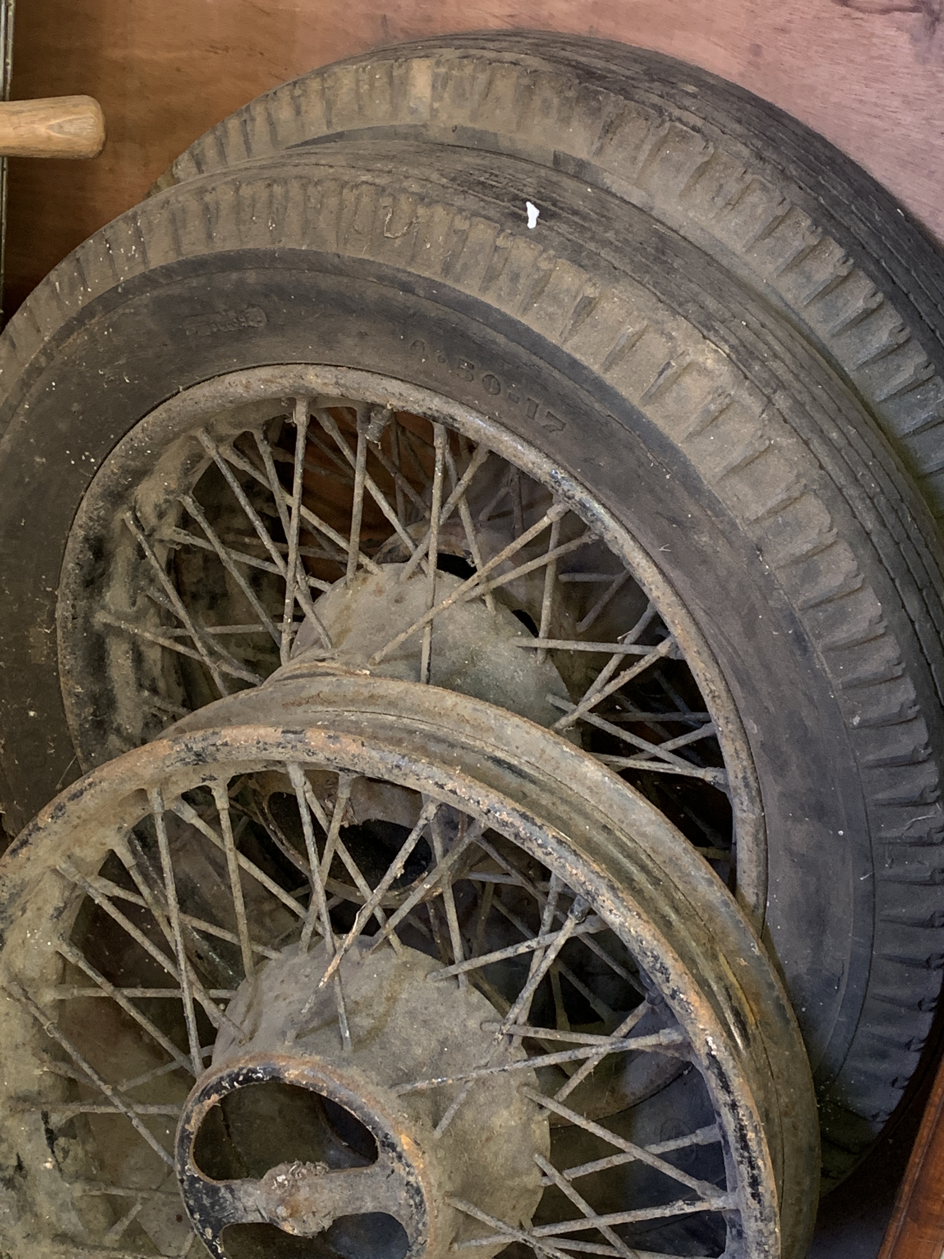 Two vintage wire wheels and tyres, together with a wire wheel
