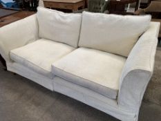 Cream upholstered large two seat sofa