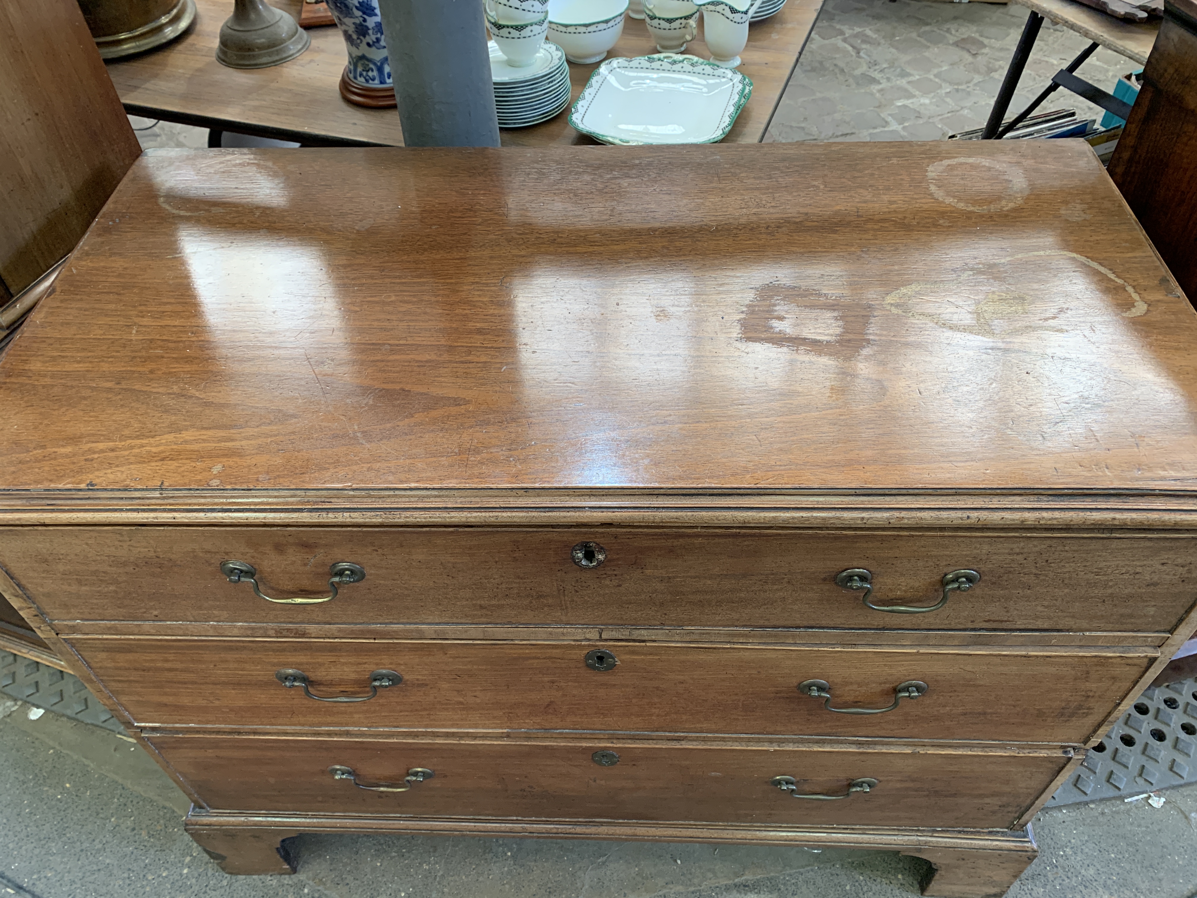 A mahogany chest of three graduated drawers. - Image 2 of 7