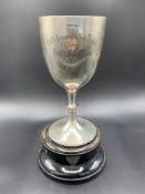Silver goblet shaped trophy, Sheffield 1910 by Walker & Hall, with black wood stand
