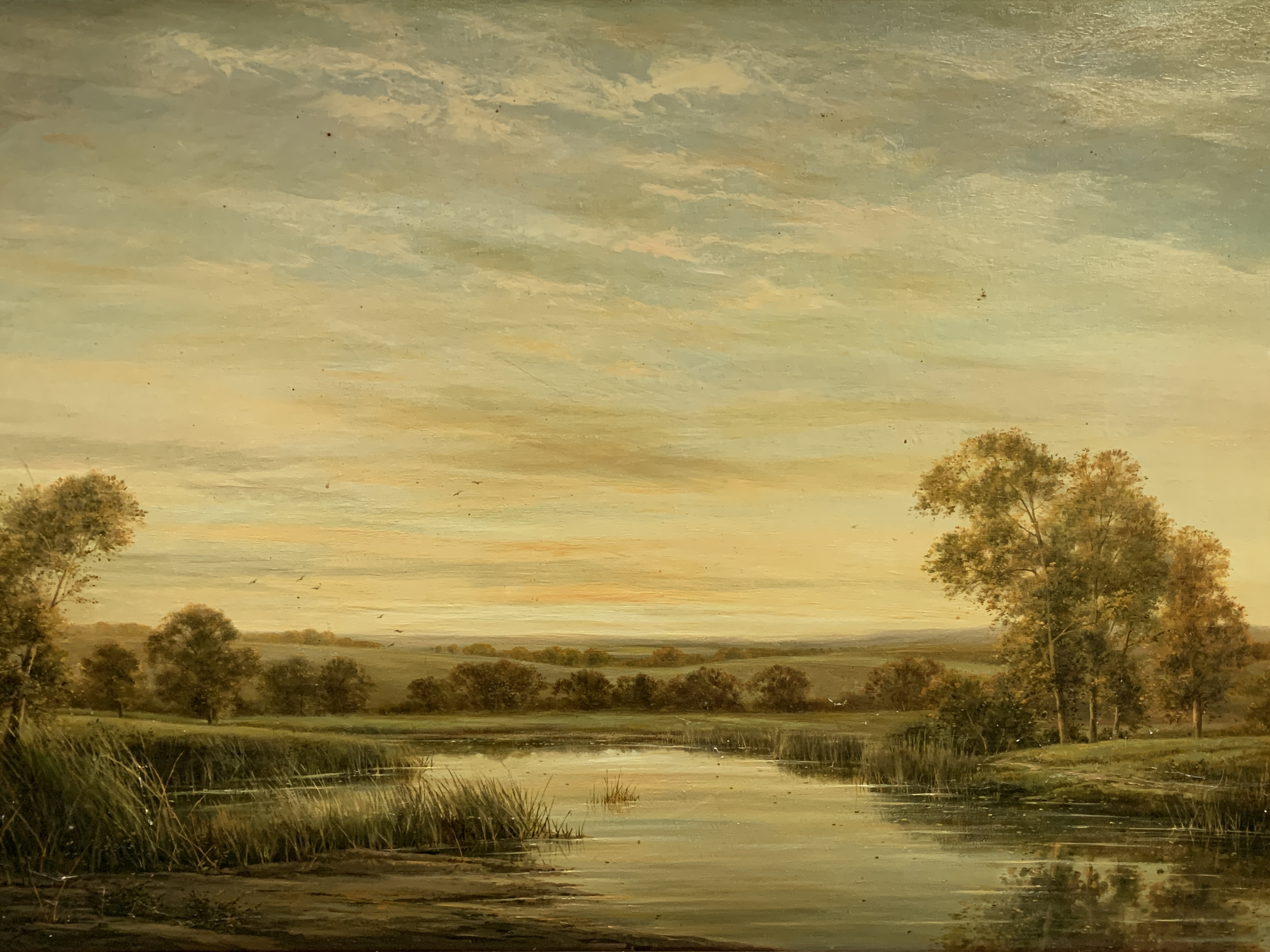 Gilt framed oil on canvas of a river and landscape, written on reverse "On the River Kennett"