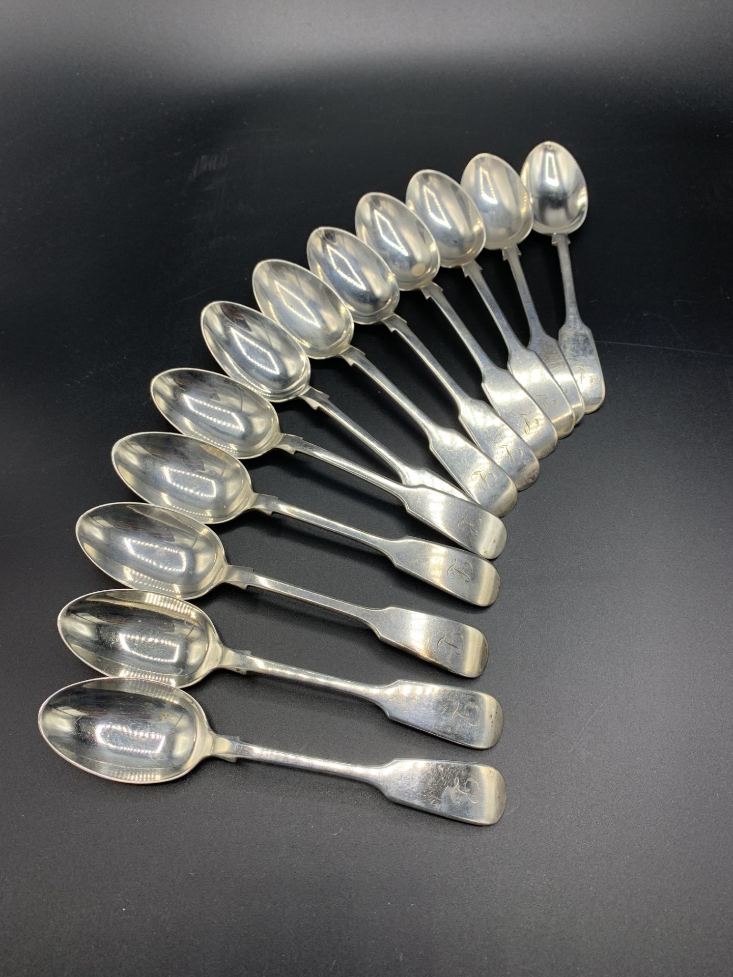 Twelve silver fiddle pattern teaspoons hallmarked 1898 (one 1896) by John Round and Son Ltd.
