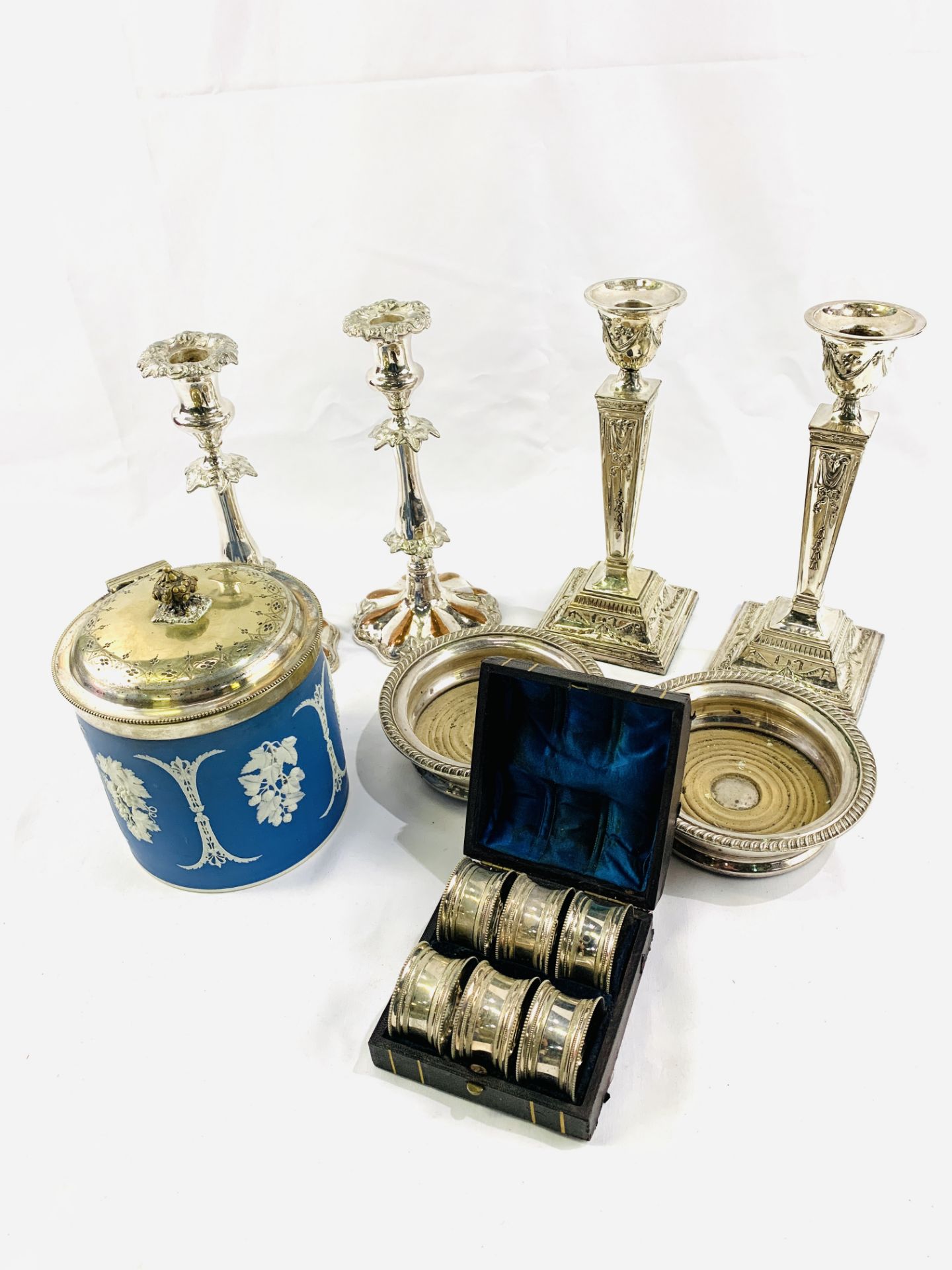 Two pairs of silver plate candlesticks together with other silver plate items