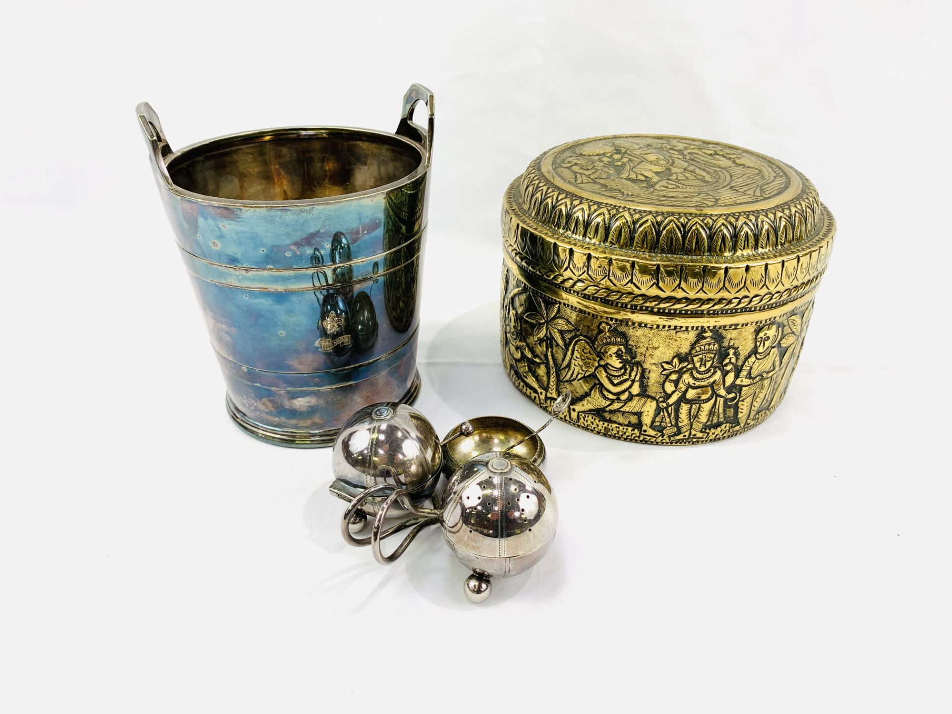Silver plate wine cooler; cruet set in the shape of a clover leaf by Elkington; and a brass pot