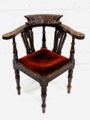 Carved oak corner armchair